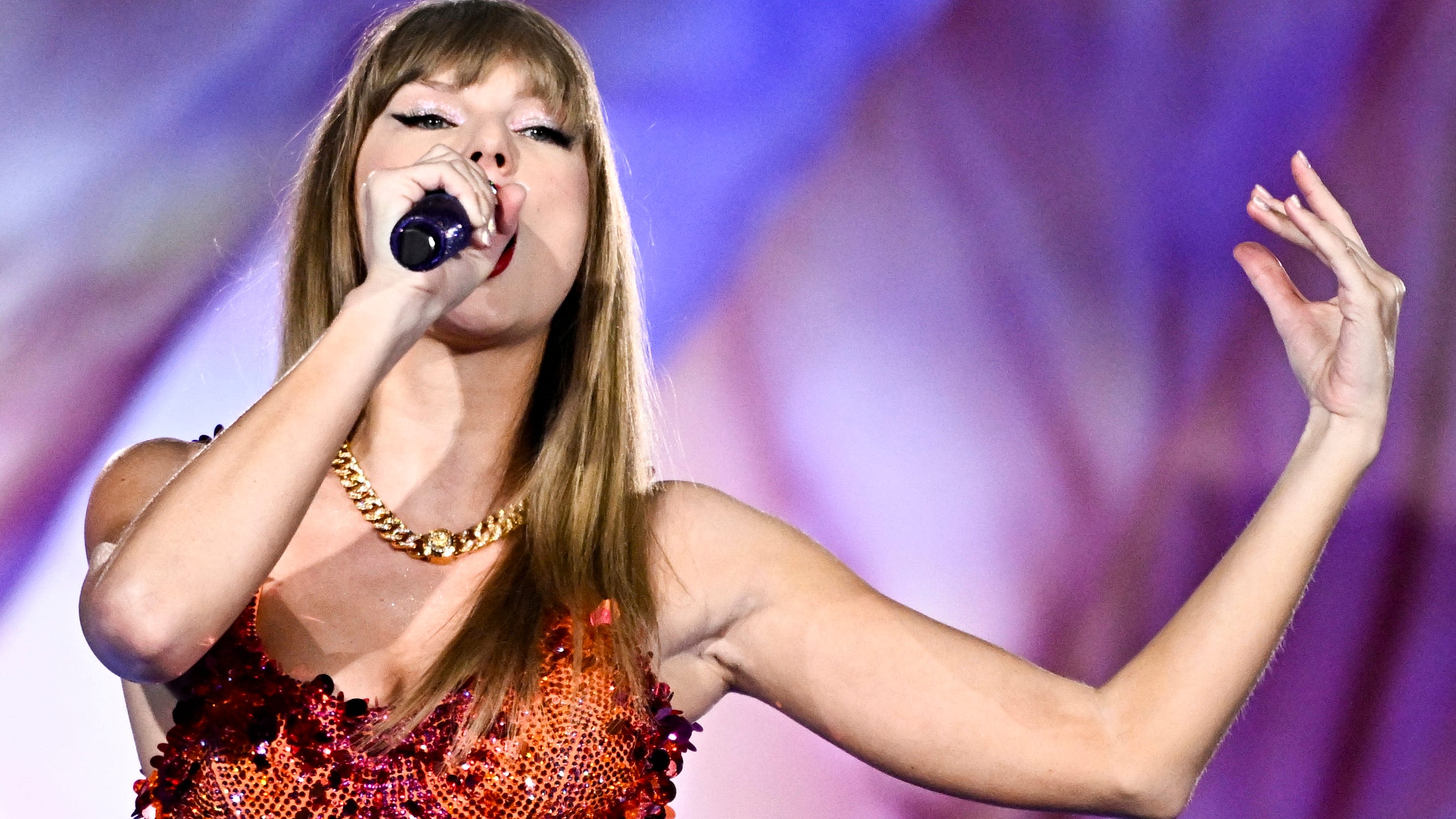 'Pluie, rain': Taylor Swift sings in a downpour on Eras Tour's first night in Lyon, France