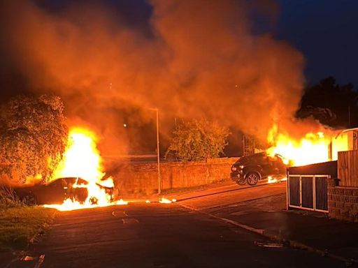 Van explodes as cars set ablaze in suspected arson