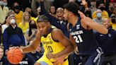 Justin Lewis will remain in the NBA draft and not return to Marquette