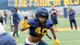 West Virginia LB Trotter remained engaged despite injury