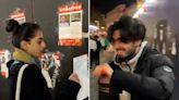 Smiling people rip down posters of kidnapped Israeli children in London’s Leicester Square
