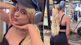Camila Cabello shows her toned tummy in a black sports bra at the gym