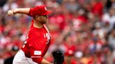 Justin Wilson's long comeback pays off with a big save as the Reds beat the Cubs