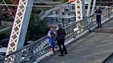 Jon Bon Jovi rushes to 'stop woman jumping off bridge' in unbelievable scenes