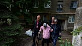 Ukrainian rescuers evacuate elderly and infirm as Russians close in