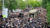 Mourners begin days of funerals for Iran's president and others killed in helicopter crash