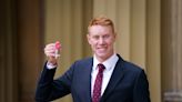 I’ve had worse Thursdays, jokes Olympic swimmer Tom Dean as he collects MBE