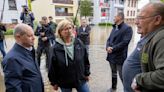 The German chancellor tours flooded regions in the southwest in a show of solidarity