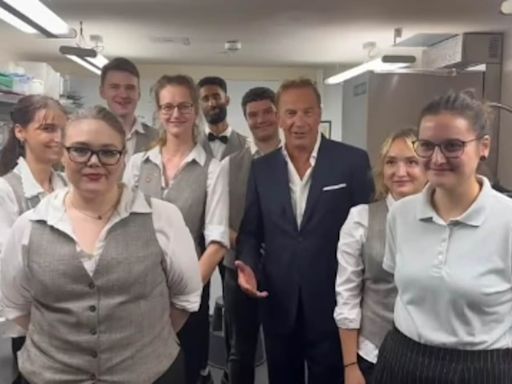 Kevin Costner visits kitchen staff during Berlin premiere of Horizon