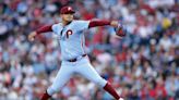 Following Walker's in-game exit, Phillies fall in extras to Mets