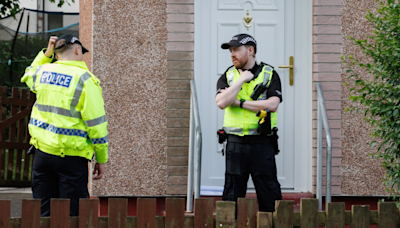 Woman dies at Glasgow house as cops lock down scene & man arrested for 'attack'