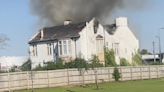 Road closed as fire breaks out at historic empty house