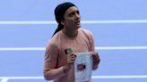 Afghan Olympic runner competes with message to the Taliban on her bib