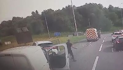 Motorway punch up caught on camera as driver 'causes crash... then gets beaten up for acting tough'