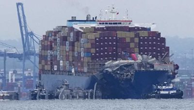 Tugboats escort container ship Dali that caused deadly Baltimore bridge collapse back to port