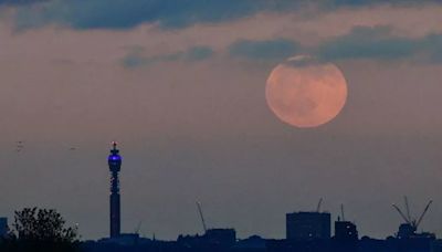 Mysterious 'long object' caught on camera moving across moon in sky above London