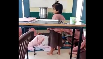 In UP’s Aligarh, teacher sleeps in classroom while students fan her. Watch viral video