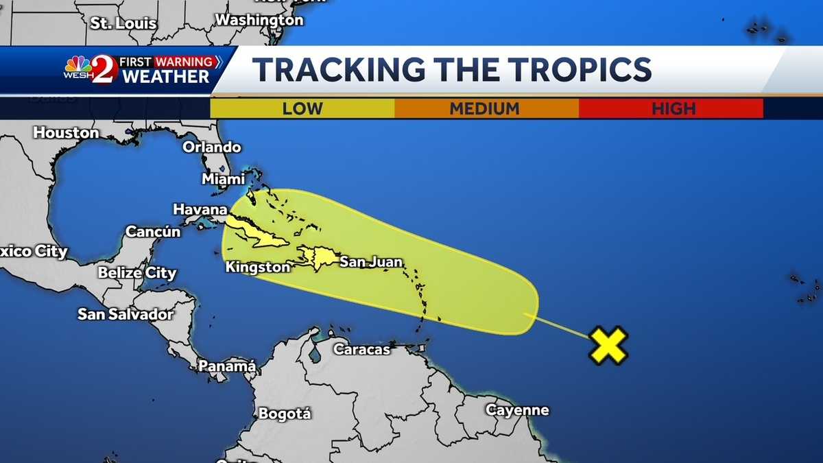 Weather disturbance in central Atlantic Ocean may interact with approaching tropical wave, NHC says