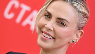 Charlize Theron Embraced the Exposed Lingerie Trend With a Tiny Bra Beneath Her Blazer