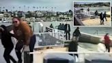 Nearly two dozen suspected migrants seen sprinting off boat as it arrives in luxe California marina