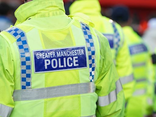 Two people arrested on suspicion of murder after man falls from Salford balcony