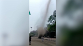 Tornado whips through steel plans as workers watch in amazement