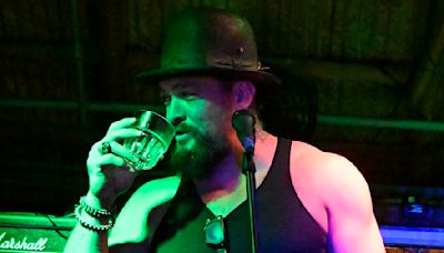 Jason Momoa swigs drink onstage after claim of 'mistreating' crew