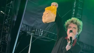 Green Day's Billie Joe Armstrong slammed for holding up Trump mask with ‘IDIOT’ scrawled after recent assassination bid (VIDEO)