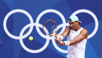 Pics: Rafael Nadal carries the Olympic torch on a memorable Parisian night