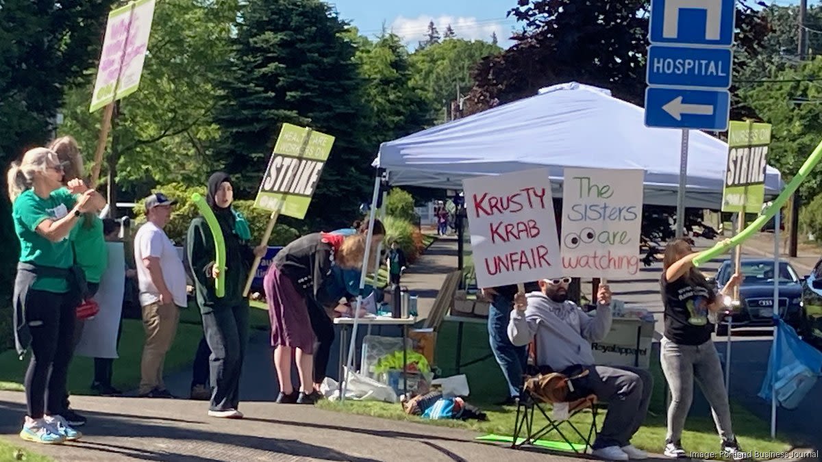 Providence nurses take to the streets in historic strike, as hospitals remain open - Portland Business Journal