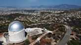 AP PHOTOS: A ferocious blaze scars the land outside Greece’s capital