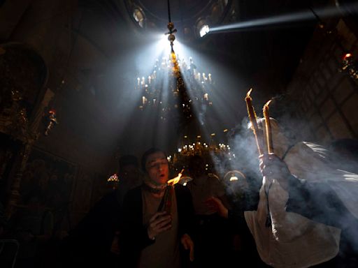 Cheers and flames as Orthodox worshipers greet the ancient ceremony of the 'Holy Fire'