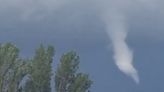 Moment funnel cloud rips through sky as Met Office issues yellow rain warning