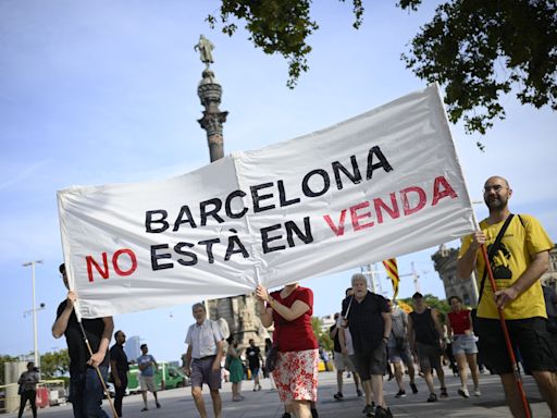 Protesters spray water guns at tourists in Barcelona as thousands rally against overtourism