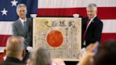 A flag carried by a WWII Japanese soldier is returning to his family