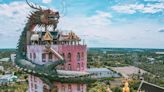 A famous pink temple in Thailand with a dragon sculpture is full of hidden details — take a closer look