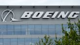 Boeing earnings: Stock weak following surprise loss, revenue miss