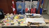 Stolen cannabis products, firearms, and more seized in Red Deer RCMP bust