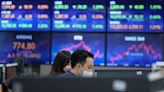 Asian stocks mixed after China promises to boost growth