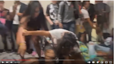 Chaos erupts as groups of brawling students pile up in hall of Florida high school