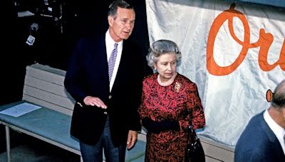 How George H.W. Bush learned very quickly that the Queen wasn't a baseball fan: New book reveals her graceful reaction during visit to a dull Orioles game that lasted two innings