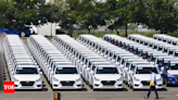 Car companies go slow on dealer dispatches on concerns around demand - Times of India