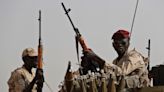 Looting and fighting reported in a central Sudan city as paramilitary group attacks military troops