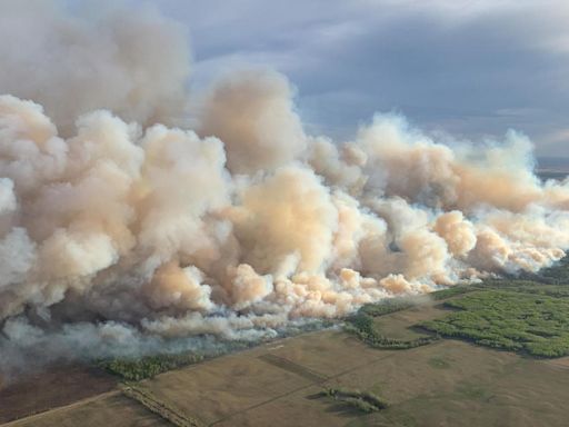 Wildfire in Canada forces thousands to evacuate as smoke causes dangerous air quality