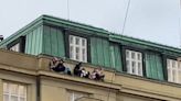 Terrified students hang from balcony to hide from gunman during Prague shooting