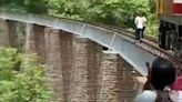 Husband and wife suffer serious injuries on bridge during photo shoot