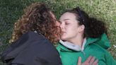 Abbie Chatfield and Adam Hyde pack on the PDA at a park in Sydney