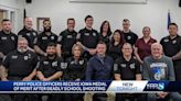 Perry police officers receive Iowa Medal of Merit after deadly school shooting