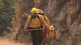 Heavy gear, unforgiving terrain, backbreaking work. Now firefighters contend with extreme heat too