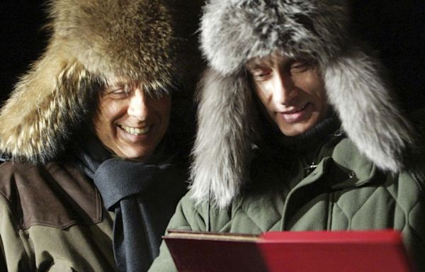 ‘An exceptional meal’: Vladimir Putin cut out a deer’s heart, presented it to Silvio Berlusconi